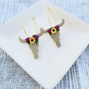 Floral cow skull earrings